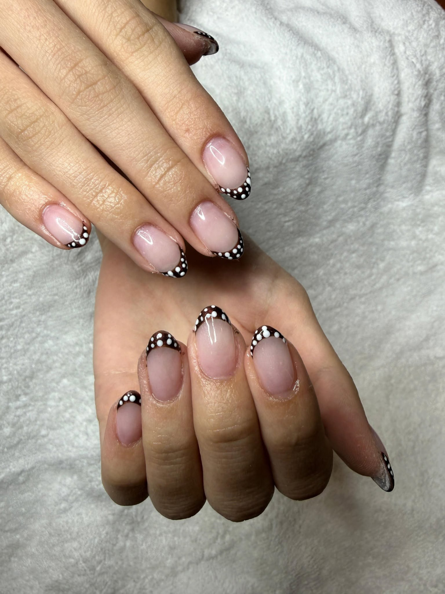 Polka dot French tip nail art by Martina at Cafuné Hair Lounge